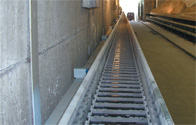 Long travel application in a bulk material stocker